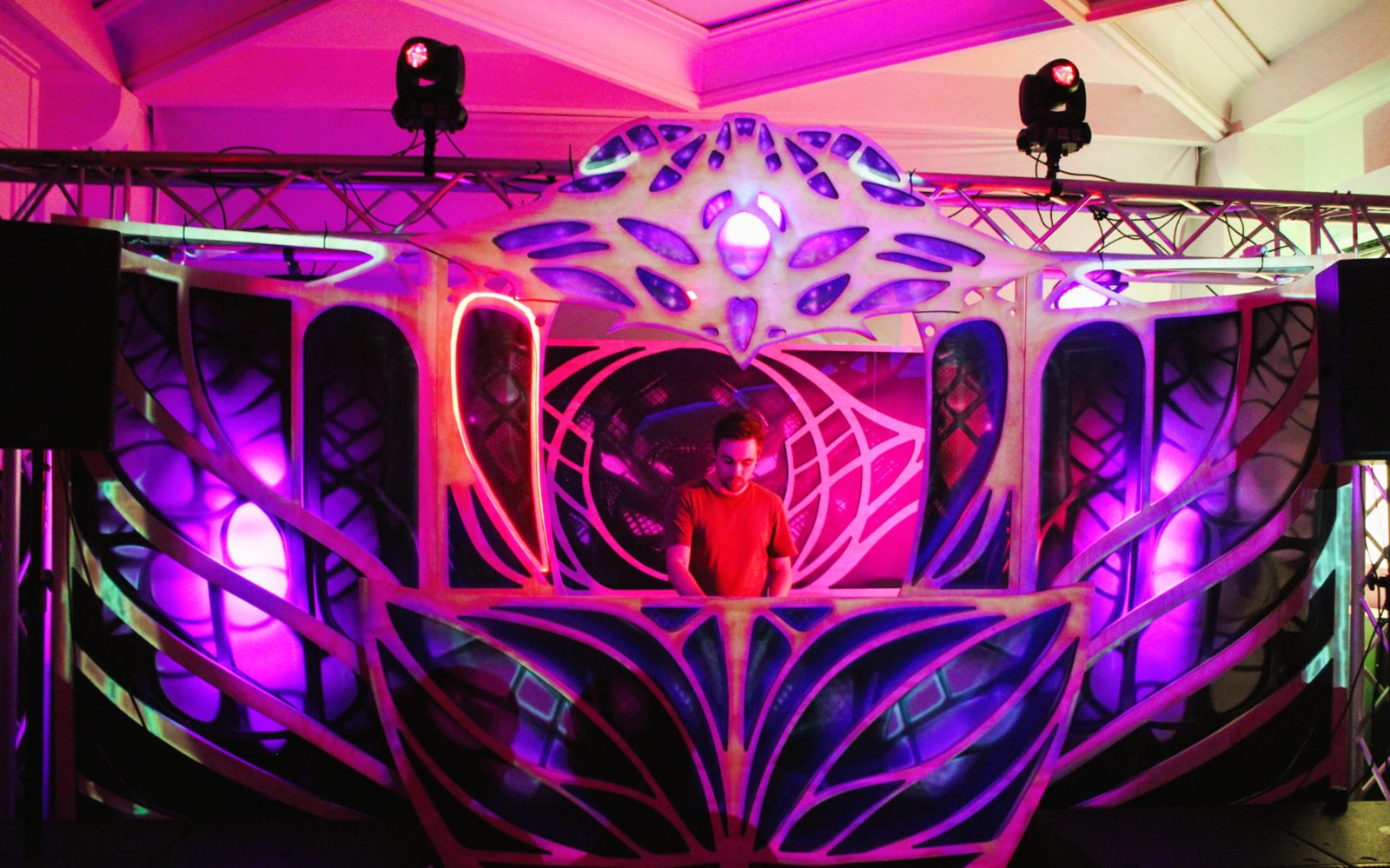 Convergence stage lit in pink and purple